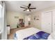 Comfortable bedroom featuring a ceiling fan, ample closet space and cozy furnishings for a pleasant retreat at 2356 Defoors Ferry Nw Rd, Atlanta, GA 30318