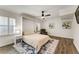 Bright bedroom with hardwood floors, a ceiling fan, and large windows overlooking the neighborhood at 2356 Defoors Ferry Nw Rd, Atlanta, GA 30318