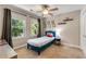 Cozy bedroom with bright windows, ceiling fan, and comfortable furnishings, creating a warm atmosphere at 2356 Defoors Ferry Nw Rd, Atlanta, GA 30318