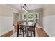 Eat-in dining area featuring a modern light fixture and a large bay window at 2356 Defoors Ferry Nw Rd, Atlanta, GA 30318