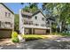 Charming two-story home featuring a balcony, garage, and beautifully landscaped front yard at 2356 Defoors Ferry Nw Rd, Atlanta, GA 30318