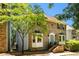 Charming brick home featuring a light blue front door, bay windows, and well-maintained landscaping at 2356 Defoors Ferry Nw Rd, Atlanta, GA 30318