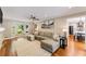 Open living room with a fireplace, hardwood floors, neutral decor, and plenty of natural light at 2356 Defoors Ferry Nw Rd, Atlanta, GA 30318
