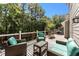 Inviting outdoor deck with furniture, a built-in grill, and a wooded view at 2356 Defoors Ferry Nw Rd, Atlanta, GA 30318