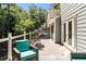 Relaxing outdoor deck features a built-in grill, seating, and lush green surroundings at 2356 Defoors Ferry Nw Rd, Atlanta, GA 30318