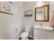 Updated powder room with a modern vanity, toilet, and stylish decor at 2356 Defoors Ferry Nw Rd, Atlanta, GA 30318