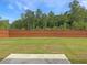 Large backyard with private wooden fence and lush green grass at 3062 Hawthorn Farm Blvd, Loganville, GA 30052
