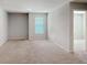Bright bedroom with neutral walls and carpeted flooring at 3062 Hawthorn Farm Blvd, Loganville, GA 30052