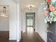 Inviting entryway with wood floors and a view into the home at 3062 Hawthorn Farm Blvd, Loganville, GA 30052