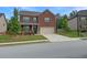 Charming two-story brick home with well-maintained landscaping and a two-car garage at 3062 Hawthorn Farm Blvd, Loganville, GA 30052