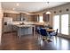 Open-concept kitchen with stainless steel appliances and a dining area at 3062 Hawthorn Farm Blvd, Loganville, GA 30052