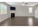 Spacious living room featuring a fireplace and ample natural light at 3062 Hawthorn Farm Blvd, Loganville, GA 30052