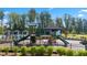 Community playground with slides and climbing equipment, fenced-in with trees surrounding at 3062 Hawthorn Farm Blvd, Loganville, GA 30052