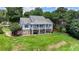 Exterior view of this home with large backyard, balcony, and lush green grass at 3715 Horizon Ct, Cumming, GA 30041