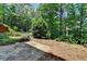 An outdoor space featuring lush landscaping and a stone pathway at 3715 Horizon Ct, Cumming, GA 30041