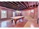 Basement game room features a pool table with exposed ductwork and neon lighting at 3715 Horizon Ct, Cumming, GA 30041