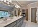 Elegant bathroom featuring a double vanity, bathtub, and a separate shower, offering a spa-like experience and modern amenities at 3715 Horizon Ct, Cumming, GA 30041