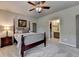 Bedroom featuring a bed, bedside table with lamp, and an ensuite bathroom at 3715 Horizon Ct, Cumming, GA 30041