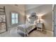 Cozy bedroom features a white metal bed frame and matching nightstands with lamps at 3715 Horizon Ct, Cumming, GA 30041