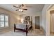 Bedroom has a bed with decorative pillows, plantation shutters, and plush carpeting at 3715 Horizon Ct, Cumming, GA 30041
