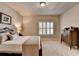 Comfortable bedroom featuring neutral walls, shutters and plush carpeting at 3715 Horizon Ct, Cumming, GA 30041