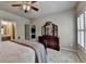 Bedroom view showing a bed, dresser, and adjacent bath through an open door at 3715 Horizon Ct, Cumming, GA 30041