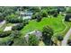 Aerial view showcasing a well-equipped community with tennis, volleyball, and pool, alongside sprawling green spaces at 3715 Horizon Ct, Cumming, GA 30041
