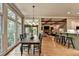 Beautiful Dining Room leading to a Bar and Kitchen area with Hardwood Floors and Lots of Natural Light at 3715 Horizon Ct, Cumming, GA 30041