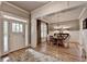 Elegant dining room featuring hardwood floors, stylish wainscoting, and a charming chandelier at 3715 Horizon Ct, Cumming, GA 30041