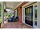 Welcoming front door with brick porch featuring comfortable seating, perfect for enjoying the outdoors at 3715 Horizon Ct, Cumming, GA 30041