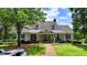 Charming exterior view featuring a covered front porch and well-manicured landscaping at 3715 Horizon Ct, Cumming, GA 30041