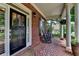 Inviting front porch with classic columns and comfortable rocking chairs, perfect for relaxing outdoors at 3715 Horizon Ct, Cumming, GA 30041