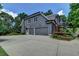 Spacious three-car garage with ample parking and landscaped surroundings, providing convenience and curb appeal at 3715 Horizon Ct, Cumming, GA 30041