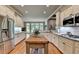 Spacious kitchen featuring an island, hardwood floors, and stainless steel appliances at 3715 Horizon Ct, Cumming, GA 30041