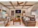 View of the living room featuring coffered ceilings, a stone fireplace and built-in shelving at 3715 Horizon Ct, Cumming, GA 30041