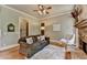 Cozy Living Room with stone fireplace, hardwood floors, and stylish furnishings at 3715 Horizon Ct, Cumming, GA 30041