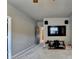 View of a living room with large screen TV, speakers, and an adjacent room at 3715 Horizon Ct, Cumming, GA 30041