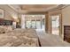 A spacious main bedroom with sitting area, providing a glimpse into the adjoining ensuite bathroom and ample natural light at 3715 Horizon Ct, Cumming, GA 30041