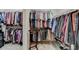 Spacious walk-in closet with ample storage space, shelving, and hanging racks at 3715 Horizon Ct, Cumming, GA 30041