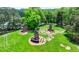 Aerial view of manicured yard featuring three decorative brick chimneys at 3715 Horizon Ct, Cumming, GA 30041