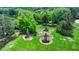 Aerial view of landscaped yard featuring three decorative brick chimneys at 3715 Horizon Ct, Cumming, GA 30041