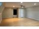 Large bonus room with laminate flooring, ample lighting, and a ceiling fan at 4715 Howard Dr, Powder Springs, GA 30127