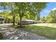 Well-maintained home featuring a long driveway and large lawn surrounded by mature trees, offering ample outdoor space at 4715 Howard Dr, Powder Springs, GA 30127