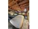 Spacious garage with motorcycle, car, and exposed wood ceiling, perfect for storage and projects at 4715 Howard Dr, Powder Springs, GA 30127