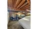 Spacious garage with wood paneling featuring storage, motorcycles, and covered cars at 4715 Howard Dr, Powder Springs, GA 30127