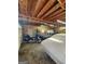 Spacious garage with motorcycle, car, and exposed wood ceiling, perfect for storage and projects at 4715 Howard Dr, Powder Springs, GA 30127