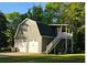 Detached two-car garage with bonus space and stairs to entry at 4715 Howard Dr, Powder Springs, GA 30127