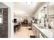 Spacious kitchen with granite countertops, stainless steel sink, and a view into the dining and living areas at 4715 Howard Dr, Powder Springs, GA 30127