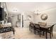 Bright kitchen and dining area featuring granite countertops, stainless steel appliances, and tile flooring at 4715 Howard Dr, Powder Springs, GA 30127