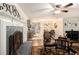 Comfortable living room flows into kitchen/dining area with a brick fireplace and open design at 4715 Howard Dr, Powder Springs, GA 30127